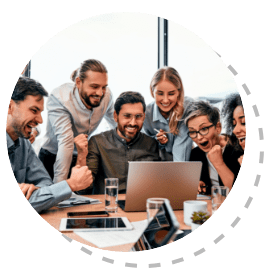 Group of employees at the office around a computer cheering